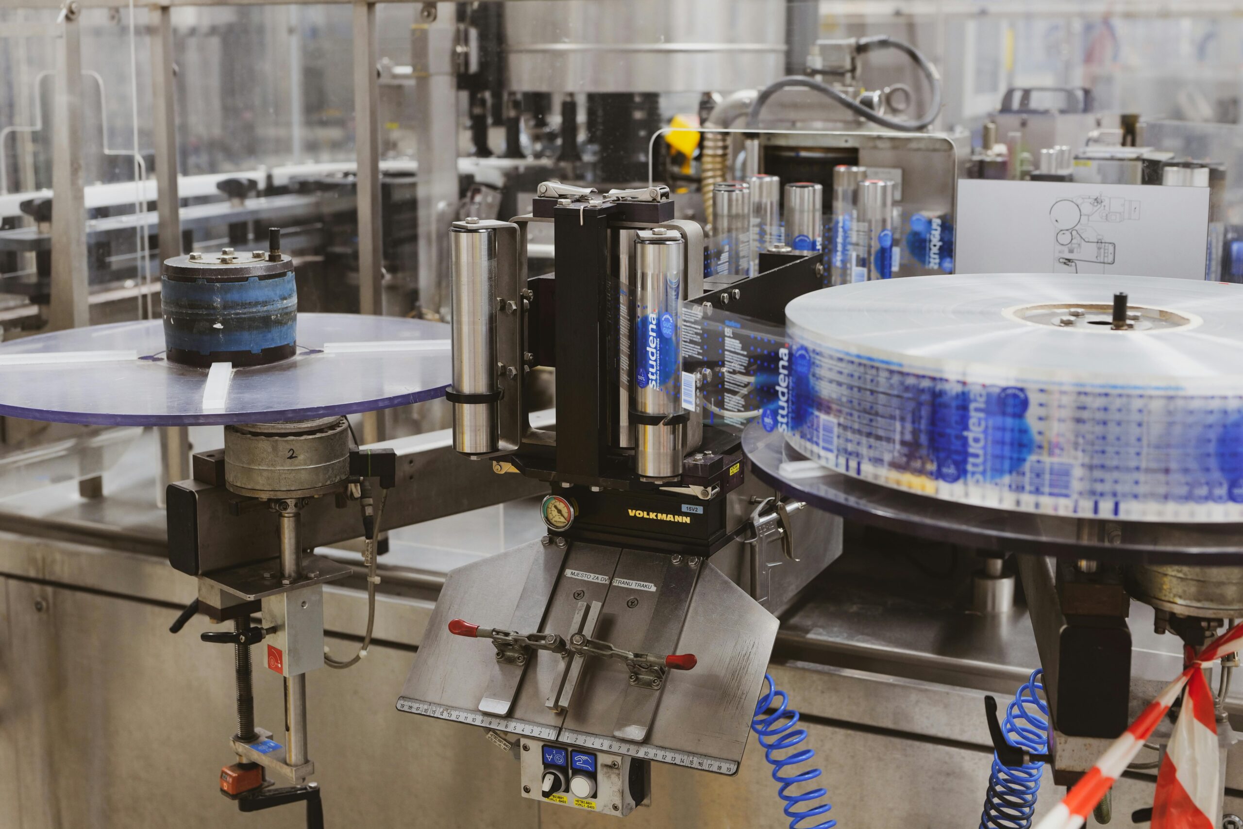 Close-up of automated machinery in a Lipik factory's production line.